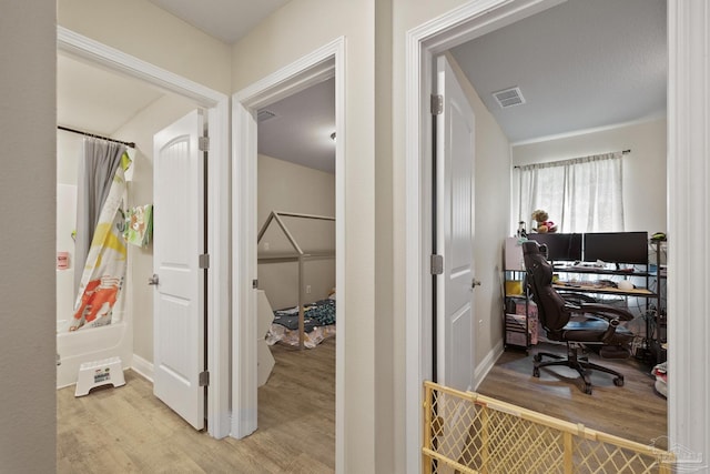 office featuring light wood-type flooring and visible vents