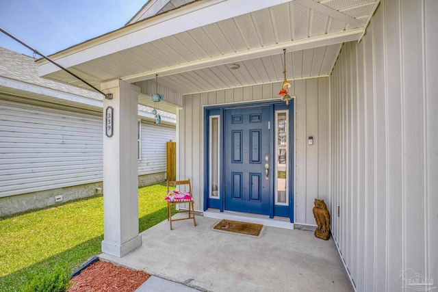 doorway to property featuring a lawn