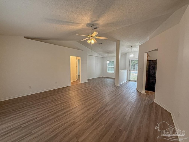 unfurnished living room featuring a textured ceiling, dark hardwood / wood-style flooring, ceiling fan, and lofted ceiling