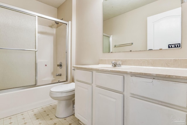 full bathroom with toilet, combined bath / shower with glass door, and vanity