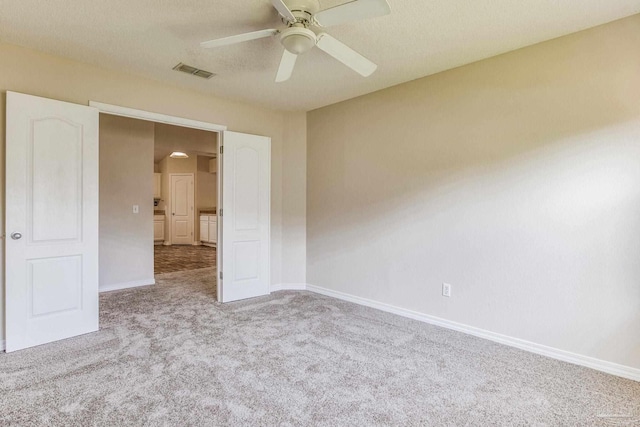 unfurnished room featuring light colored carpet and ceiling fan