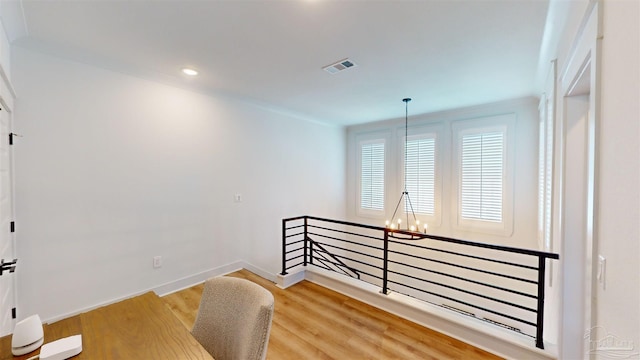 interior space with a chandelier and light wood-type flooring