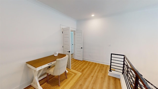 home office featuring hardwood / wood-style flooring and ornamental molding