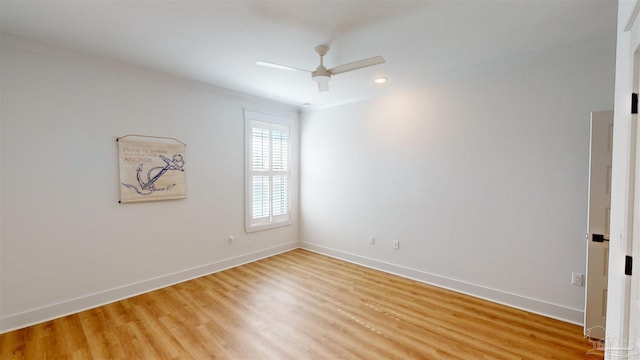 spare room with ceiling fan and light hardwood / wood-style floors