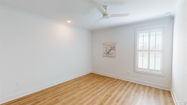 unfurnished room featuring ceiling fan, crown molding, and light hardwood / wood-style flooring