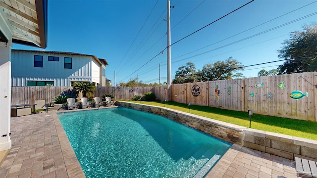 view of swimming pool featuring a patio area