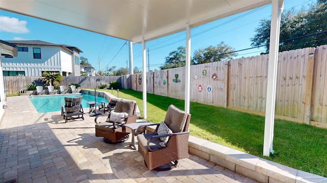 view of patio with a fenced in pool