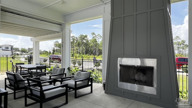 view of patio with a fireplace