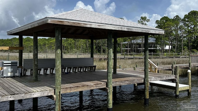 view of dock featuring a gazebo and a water view