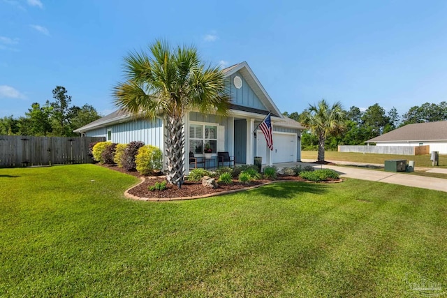 single story home featuring concrete driveway, a garage, fence, and a front yard