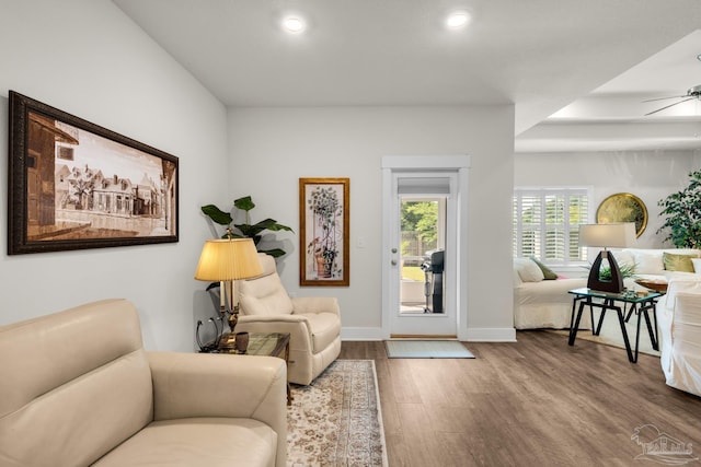 living room featuring recessed lighting, baseboards, a ceiling fan, and wood finished floors