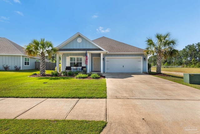 view of front of house with driveway, a garage, board and batten siding, and a front yard
