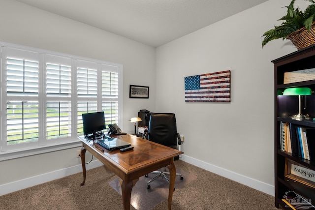 home office featuring carpet flooring and baseboards