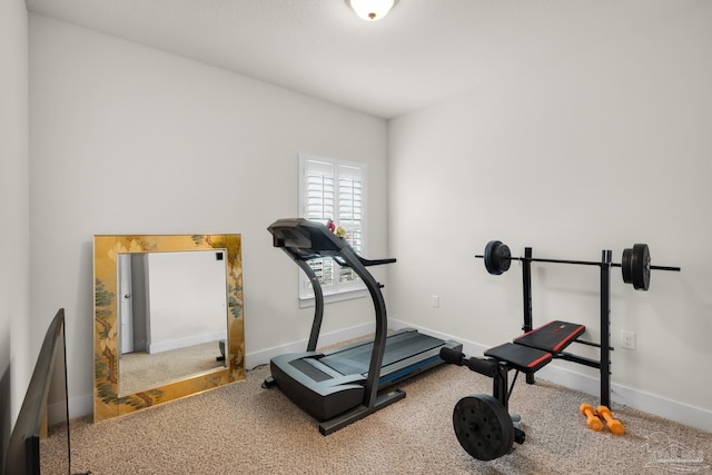 exercise room featuring carpet flooring and baseboards