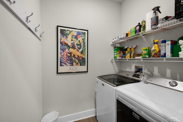 laundry room with laundry area, baseboards, and washer and dryer