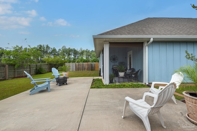 view of patio / terrace with a fire pit and a fenced backyard