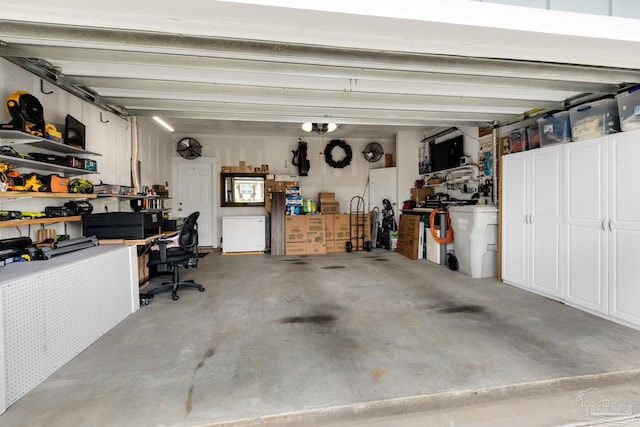 garage with a workshop area