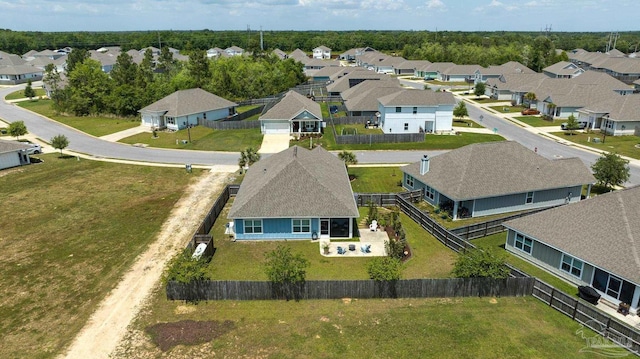 birds eye view of property with a residential view