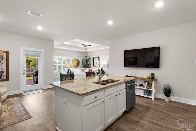 kitchen with a sink, dark wood-type flooring, recessed lighting, dishwasher, and open floor plan