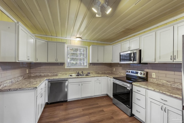 kitchen with dark wood-style floors, wood ceiling, stainless steel appliances, and a sink