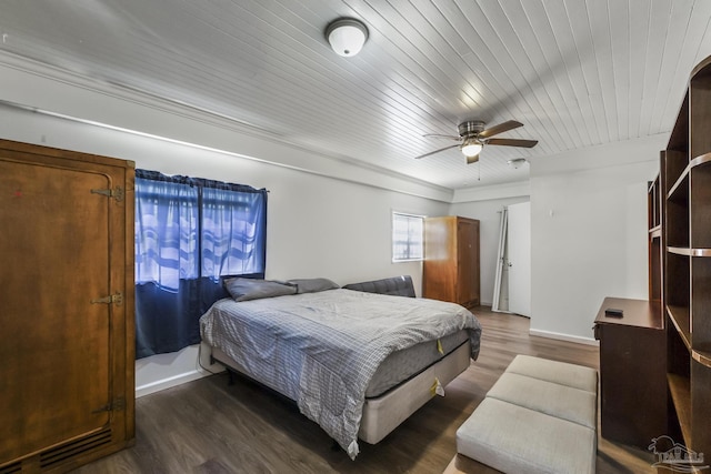 bedroom with wooden ceiling, a ceiling fan, baseboards, and wood finished floors