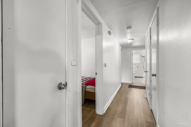 hall featuring wood finished floors