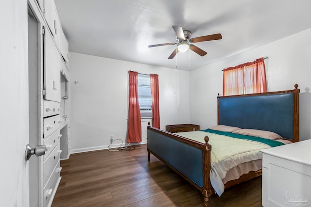 bedroom with ceiling fan, dark wood-type flooring, and a closet