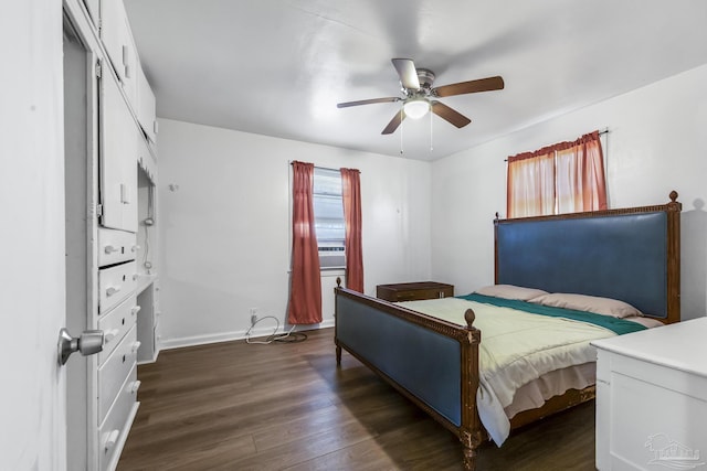 bedroom with a ceiling fan, dark wood-style flooring, and baseboards