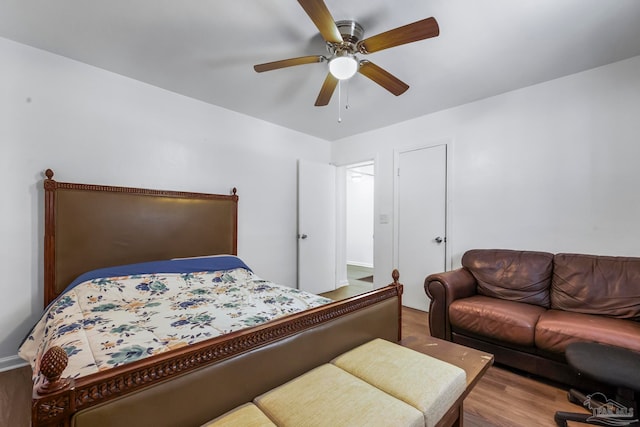 bedroom with ceiling fan and wood-type flooring