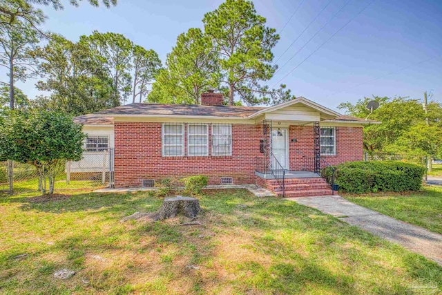 ranch-style house with a front yard, crawl space, brick siding, and a chimney