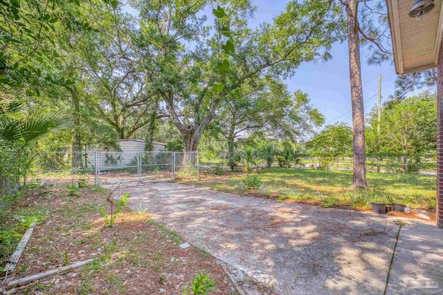 view of yard with a gate and fence