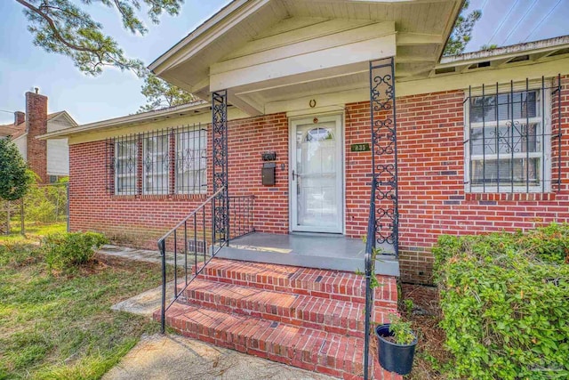 entrance to property with brick siding