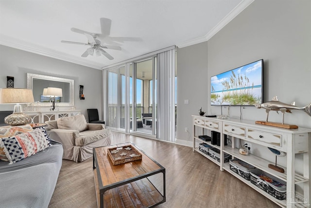 living room featuring ceiling fan, ornamental molding, and hardwood / wood-style floors