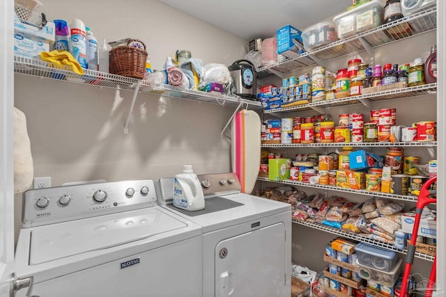 laundry room with laundry area and washing machine and clothes dryer