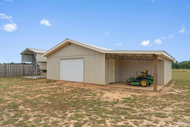 exterior space featuring a garage and fence