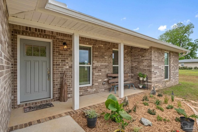 entrance to property with brick siding