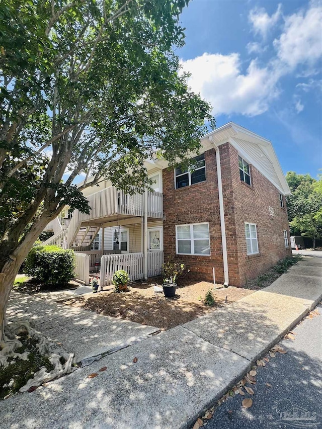 1100 Shoreline Dr Unit 207, Gulf Breeze, FL 32561 - townhome / multi-family property featuring brick siding and stairway