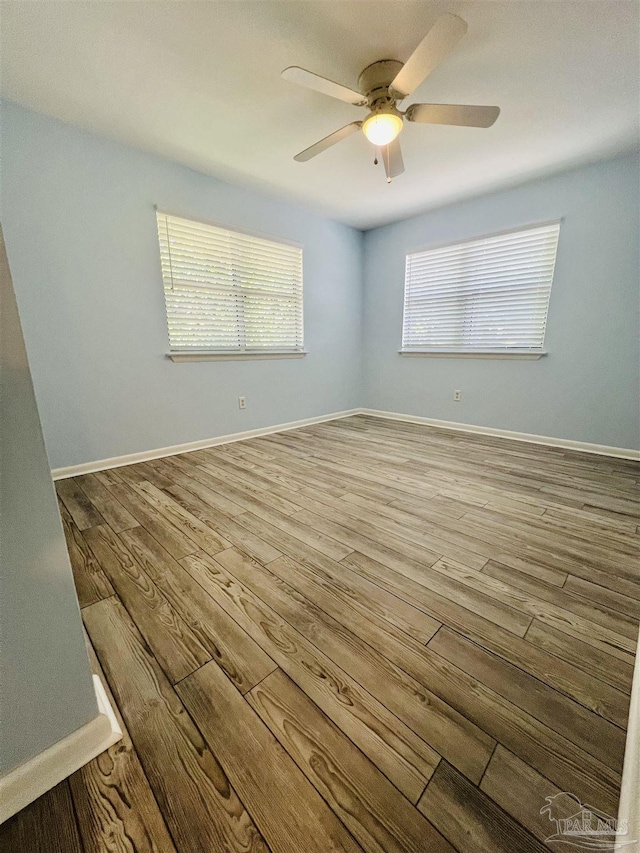 1100 Shoreline Dr Unit 207, Gulf Breeze, FL 32561 - empty room with ceiling fan, wood finished floors, and baseboards