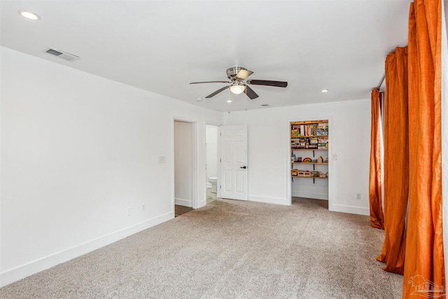 unfurnished bedroom with ceiling fan and carpet flooring