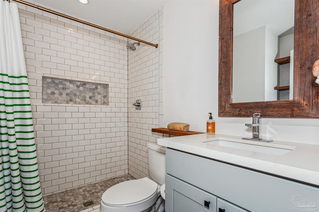 bathroom with vanity, toilet, and a shower with curtain