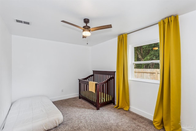 carpeted bedroom featuring ceiling fan