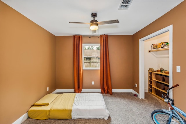 carpeted bedroom with ceiling fan