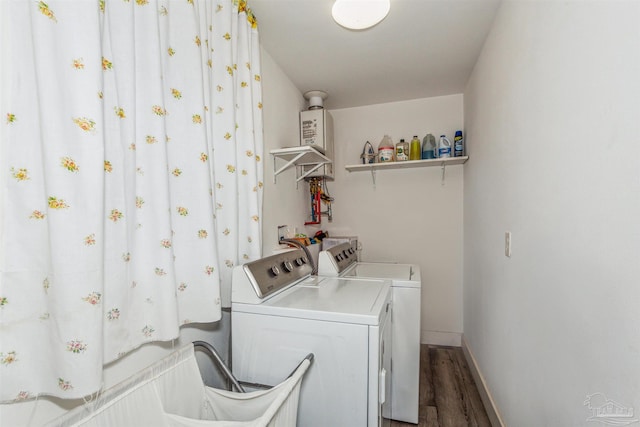 laundry area with independent washer and dryer and wood-type flooring