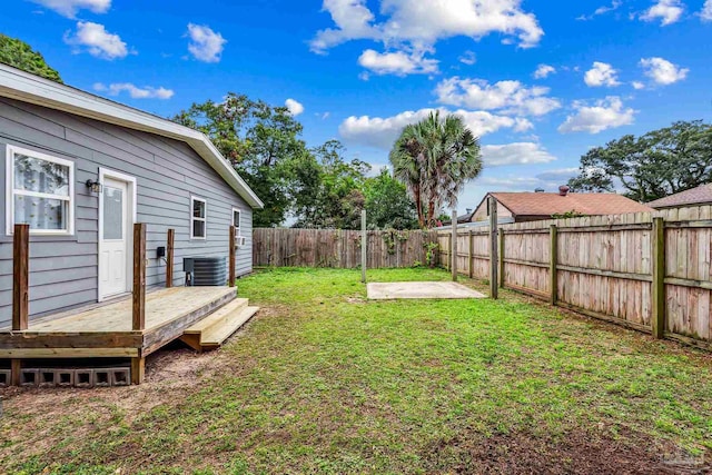 view of yard featuring a deck and cooling unit