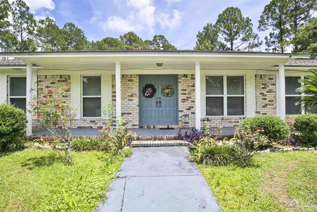 ranch-style house featuring covered porch