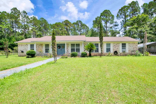 ranch-style home featuring a front yard