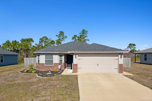 view of front of house with a front yard and a garage