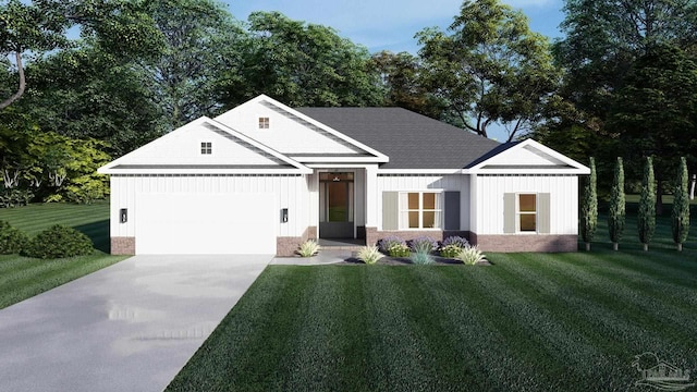 view of front of home with a garage and a front lawn