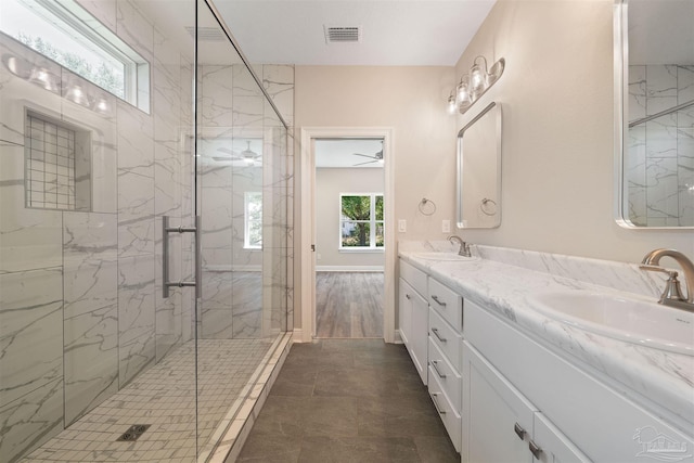 bathroom with vanity and an enclosed shower