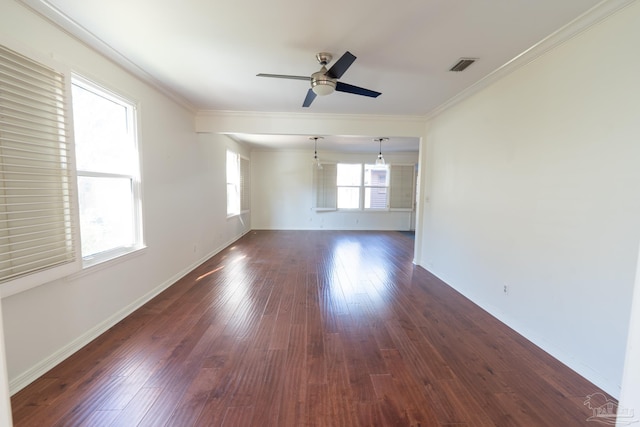 spare room featuring dark hardwood / wood-style flooring, ceiling fan, and ornamental molding